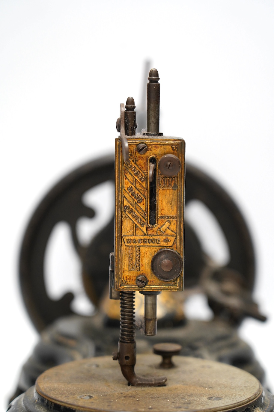 A late 19th century Jones swan neck sewing machine, with cast iron base and gilt ivy decoration to the frame. Condition - fair